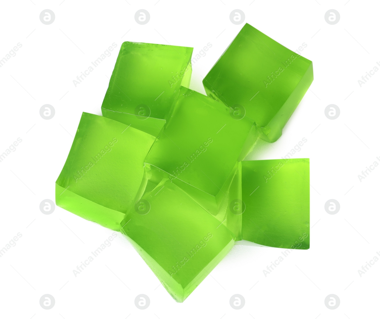 Photo of Heap of green jelly cubes on white background, top view