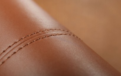 Texture of brown leather as background, closeup