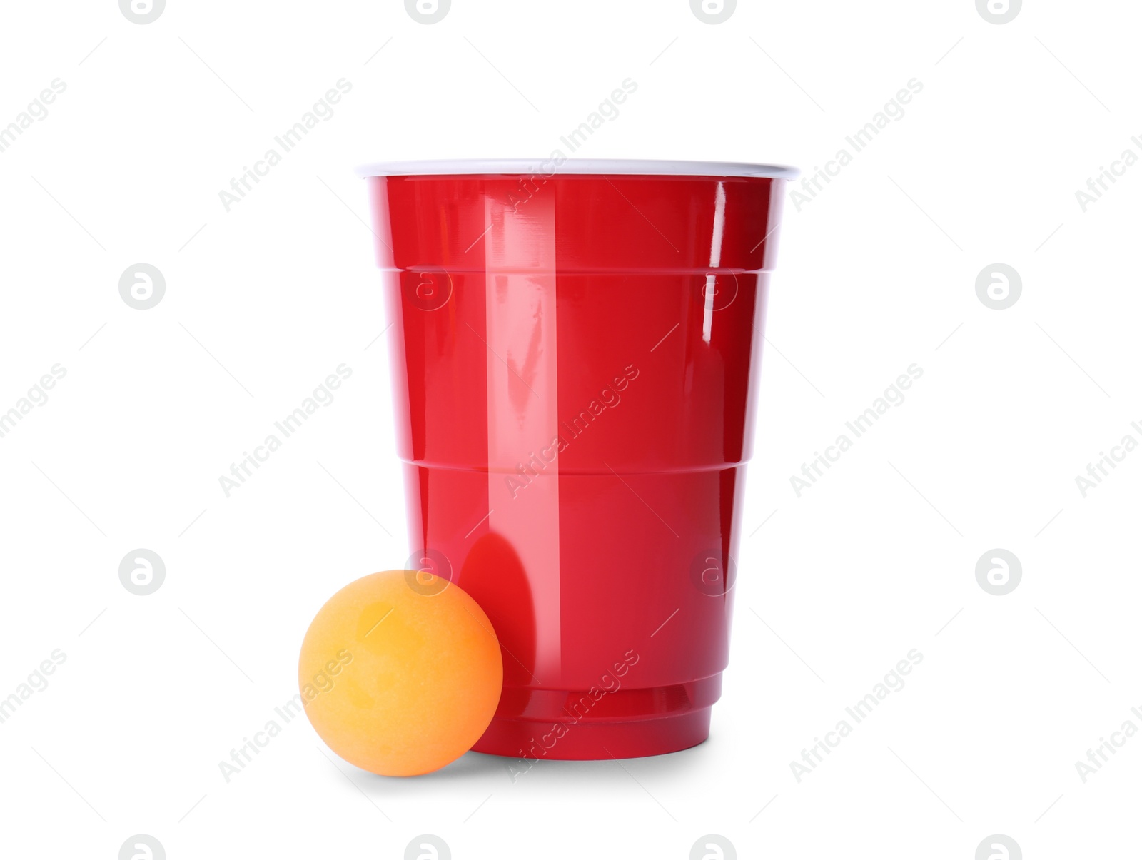 Photo of Red plastic cup and ball for beer pong on white background