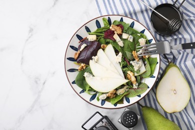 Photo of Delicious pear salad in bowl served on white marble table, flat lay. Space for text