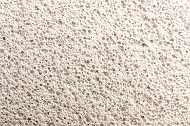 Photo of Texture of white pumice stone as background, closeup