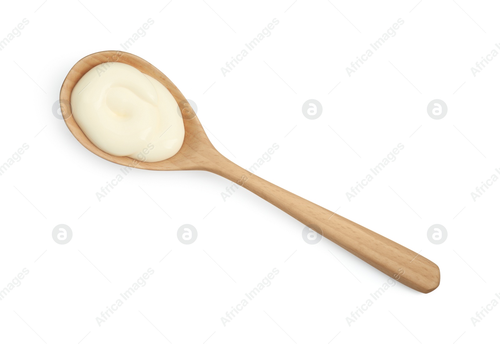 Photo of Fresh mayonnaise sauce in wooden spoon isolated on white, top view