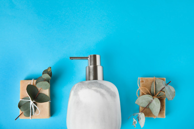 Photo of Flat lay composition with marble soap dispenser on light blue background. Space for text