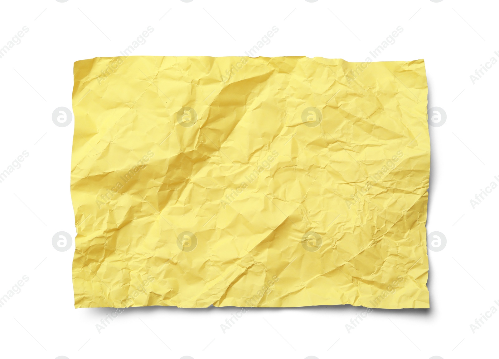 Photo of Color sheet of crumpled paper on white background, top view