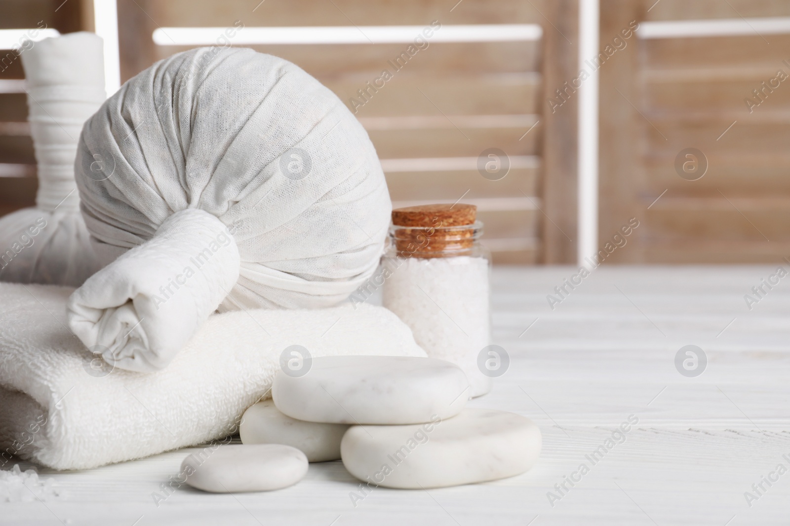 Photo of Spa composition with skin care products on white wooden table, space for text