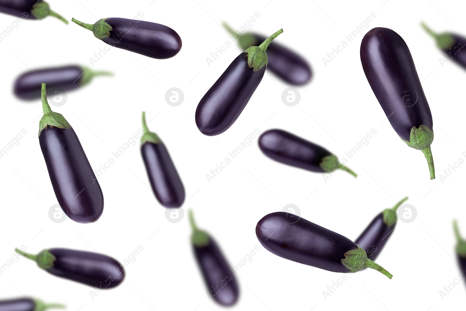 Image of Fresh whole eggplants falling on white background