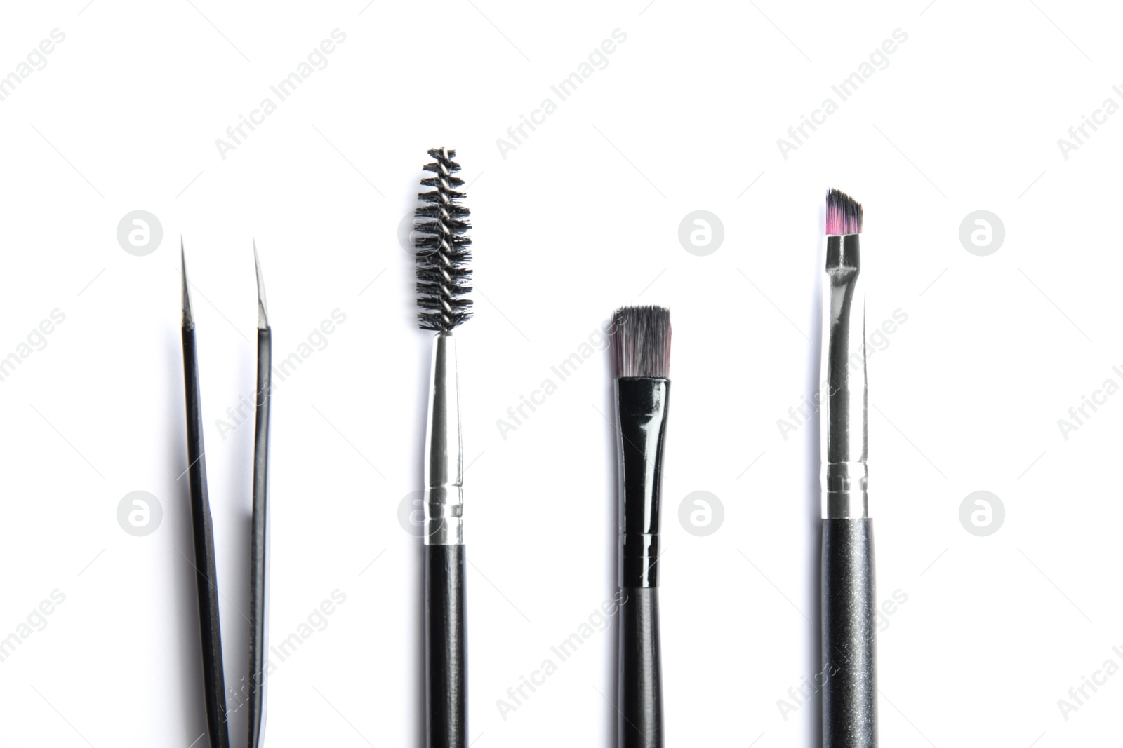 Photo of Set of professional eyebrow tools on white background, top view