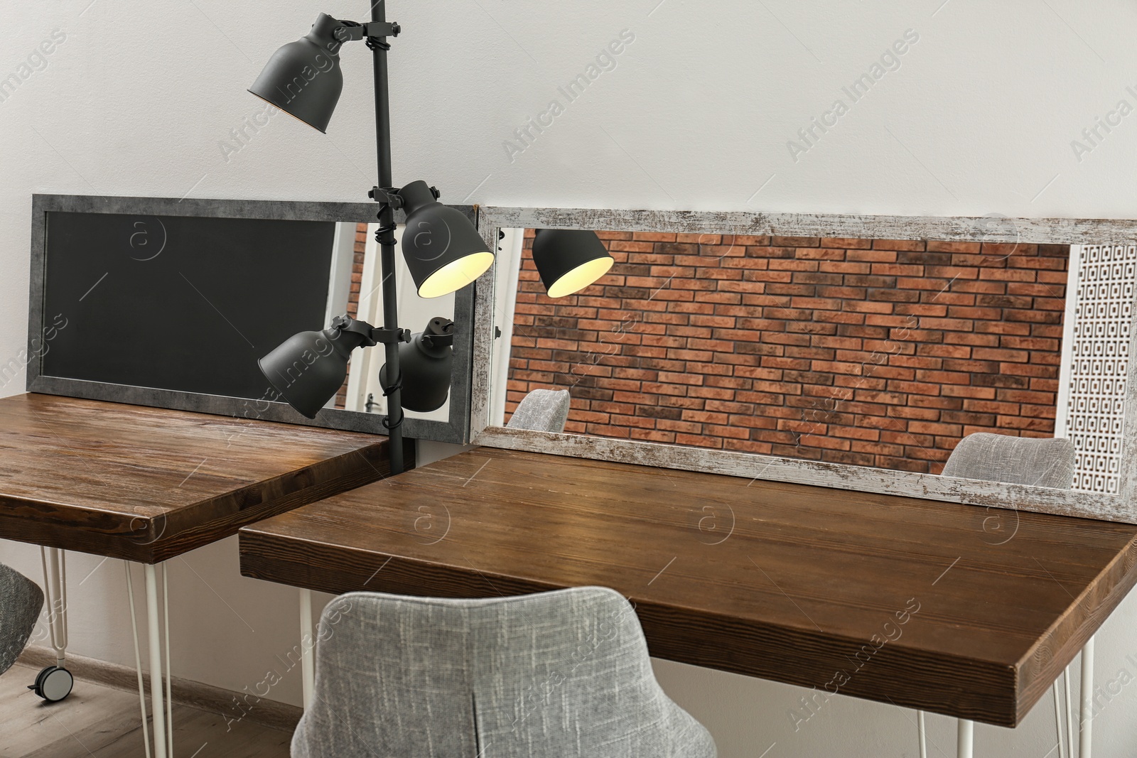 Photo of Empty dressing tables with mirrors in makeup room