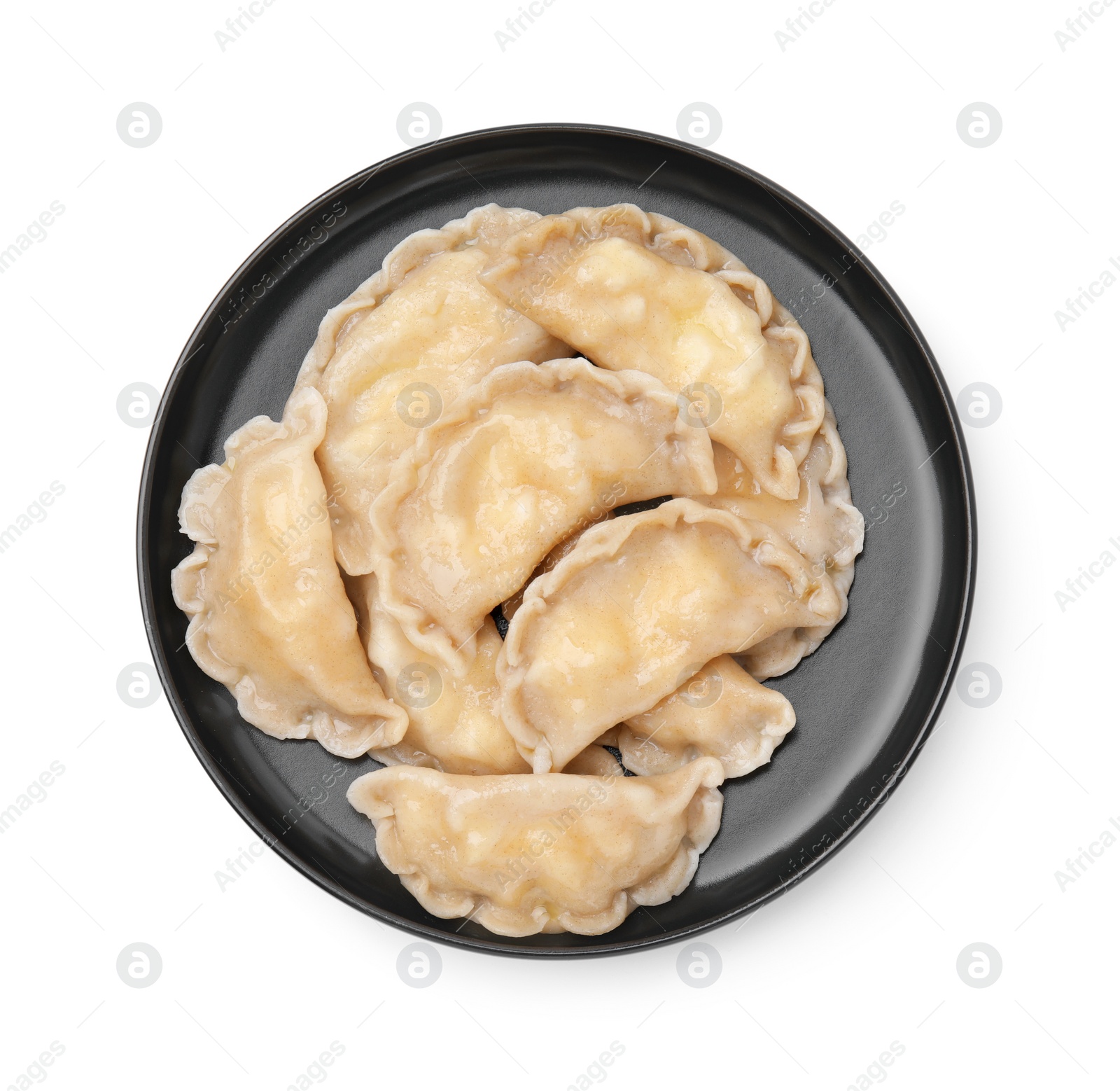 Photo of Plate of delicious dumplings (varenyky) with cottage cheese isolated on white, top view