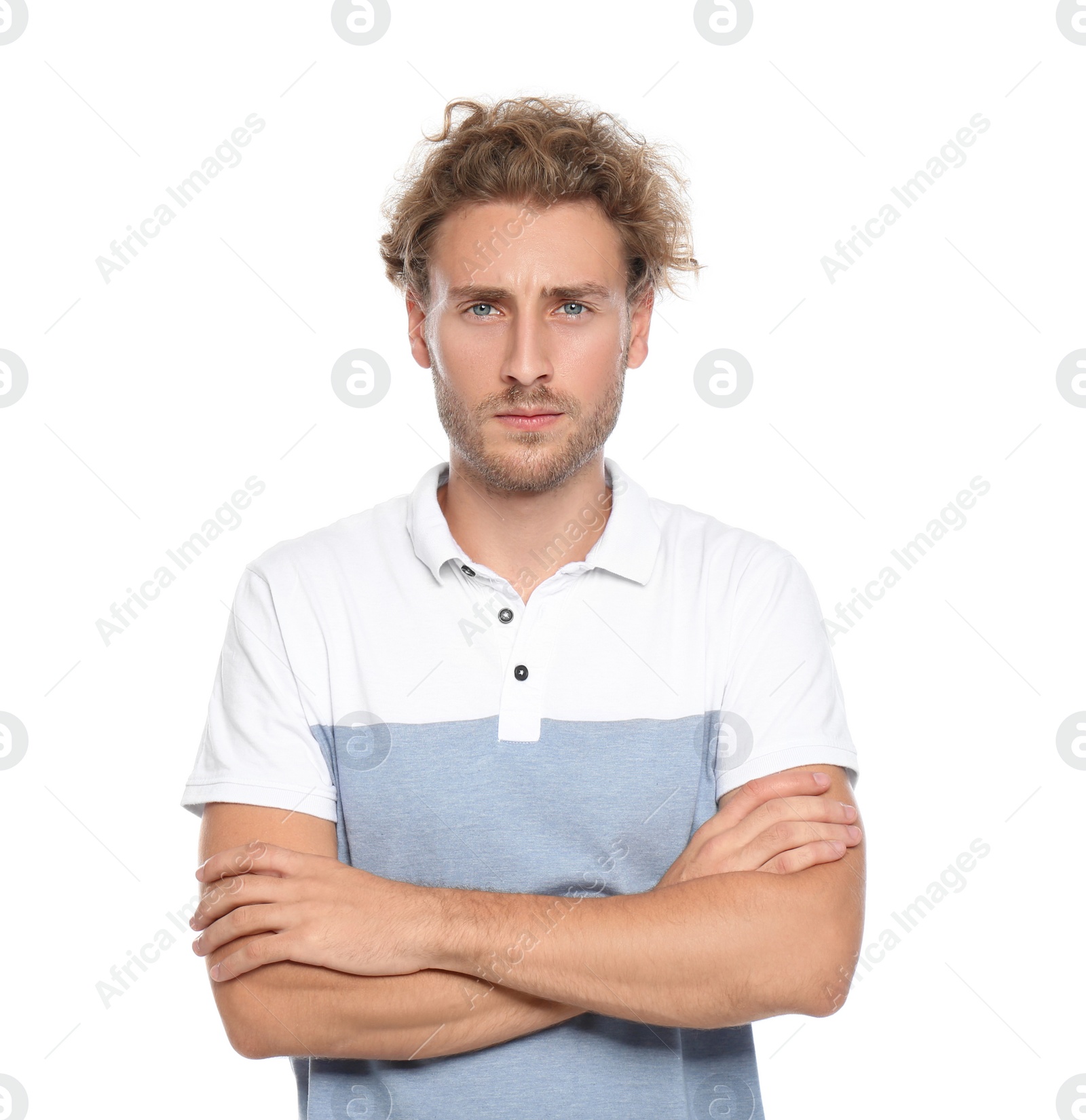 Photo of Young man in casual clothes posing on white background