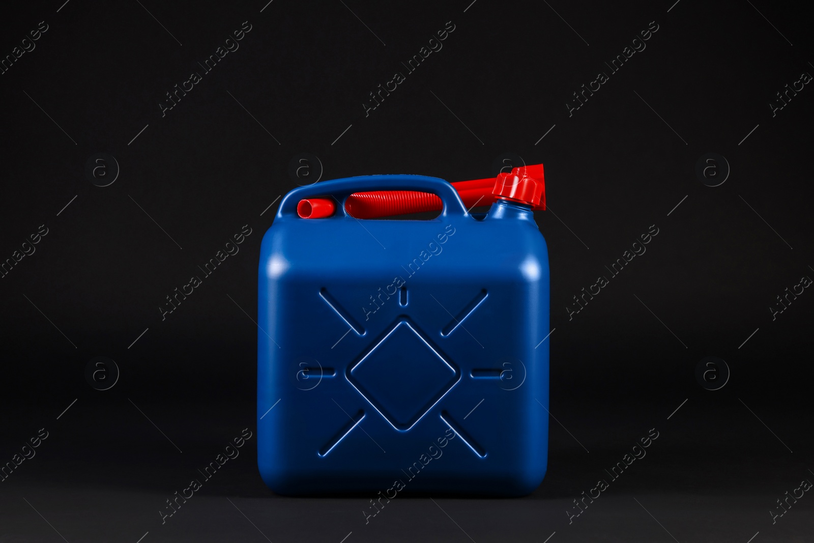 Photo of New blue plastic canister on black background