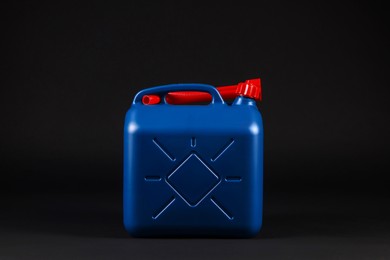 New blue plastic canister on black background