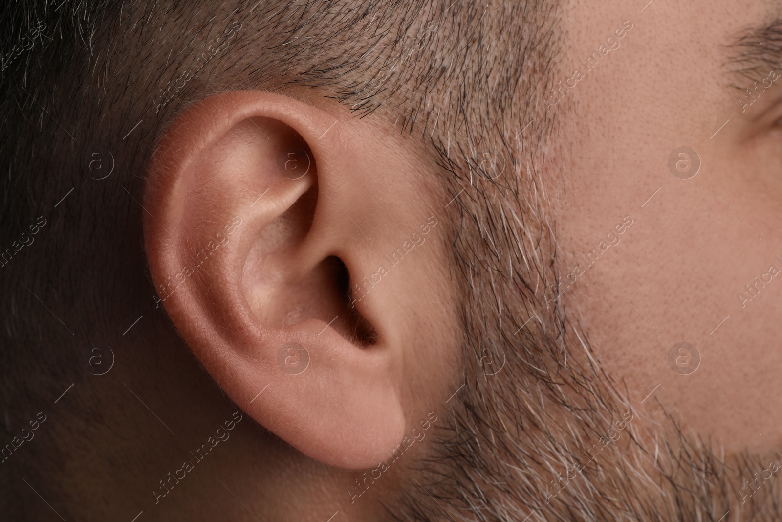 Photo of Closeup view of man, focus on ear