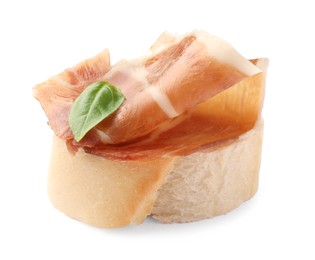 Photo of Tasty sandwich with cured ham and basil leaf isolated on white