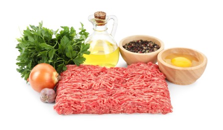 Photo of Raw ground meat, spices, egg, oil and parsley isolated on white