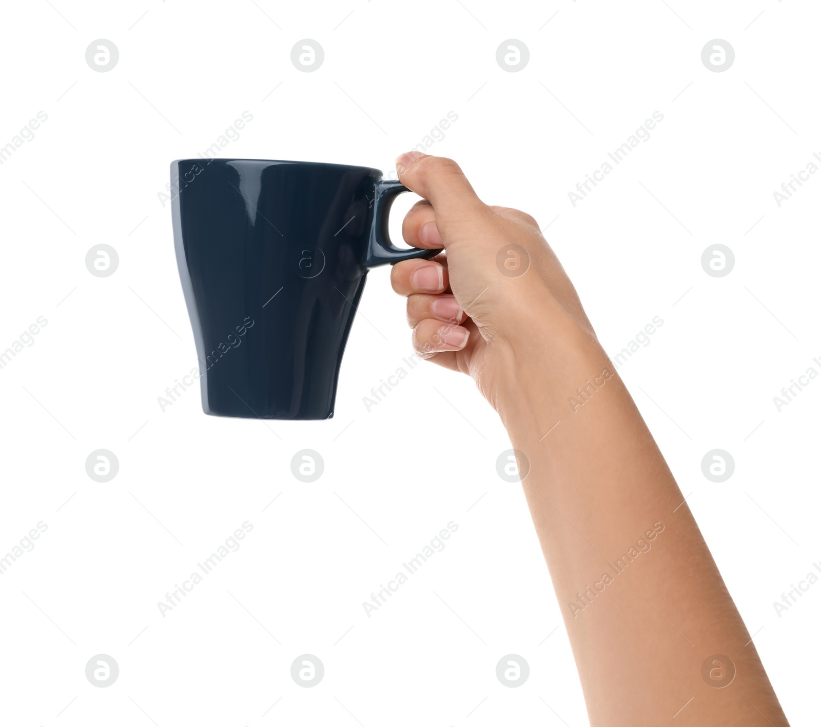 Photo of Woman holding elegant dark blue cup on white background, closeup