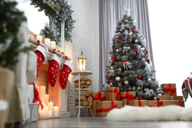 Beautiful decorated Christmas tree in living room interior