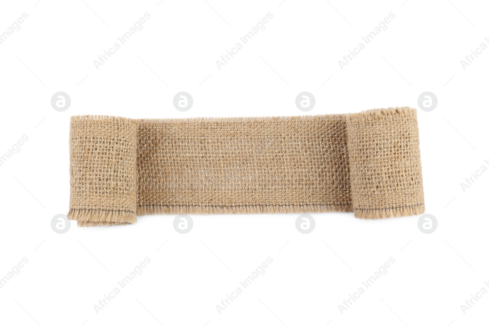 Photo of Unrolled burlap ribbon isolated on white, top view