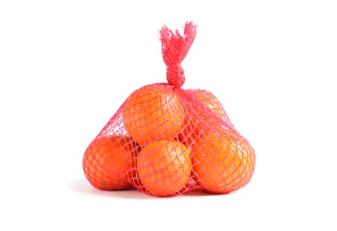 Photo of Mesh bag with tangerines on white background