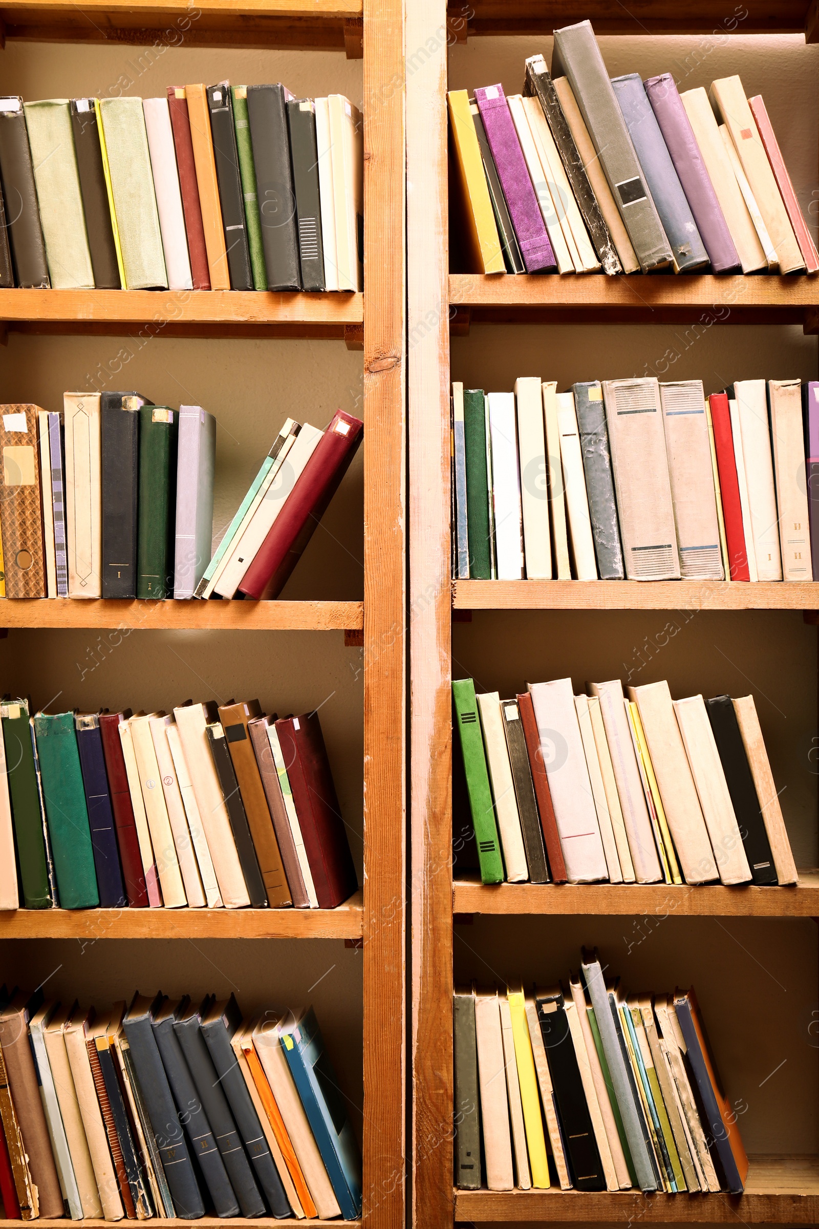 Image of Collection of different books on shelves in library