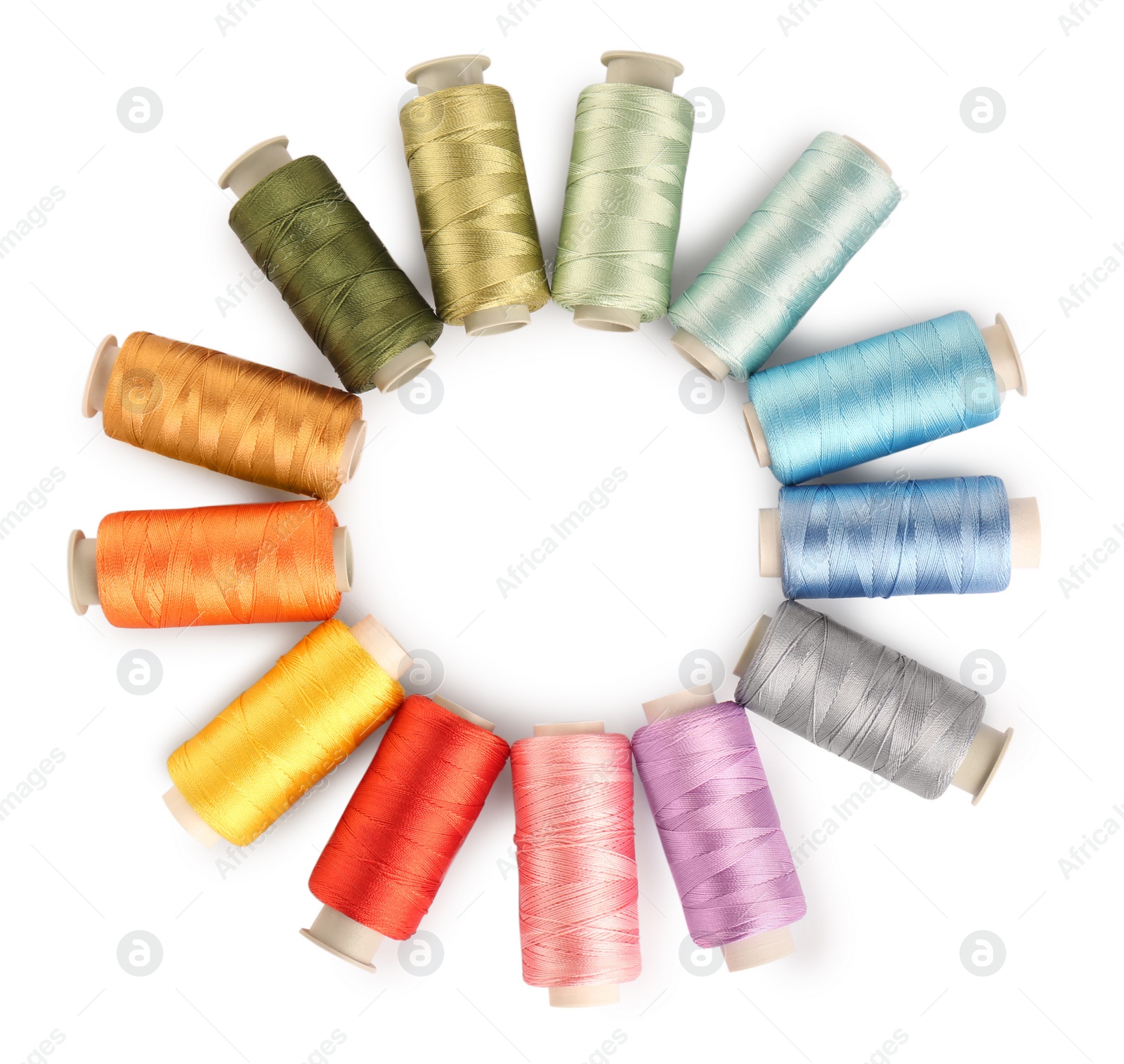 Photo of Frame of colorful sewing threads on white background, top view. Space for text