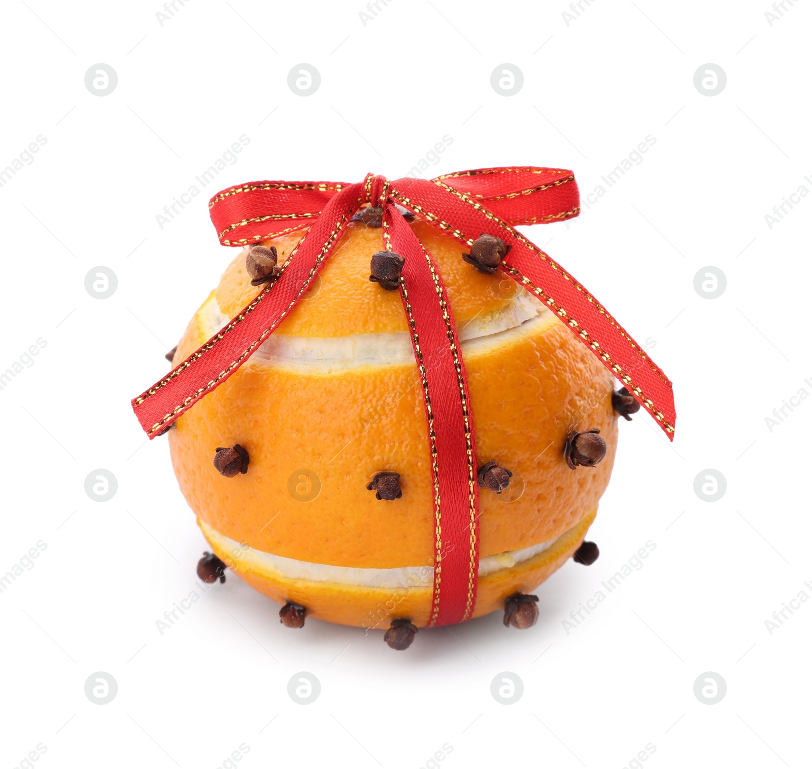 Photo of Pomander ball with red ribbon made of fresh tangerine and cloves isolated on white