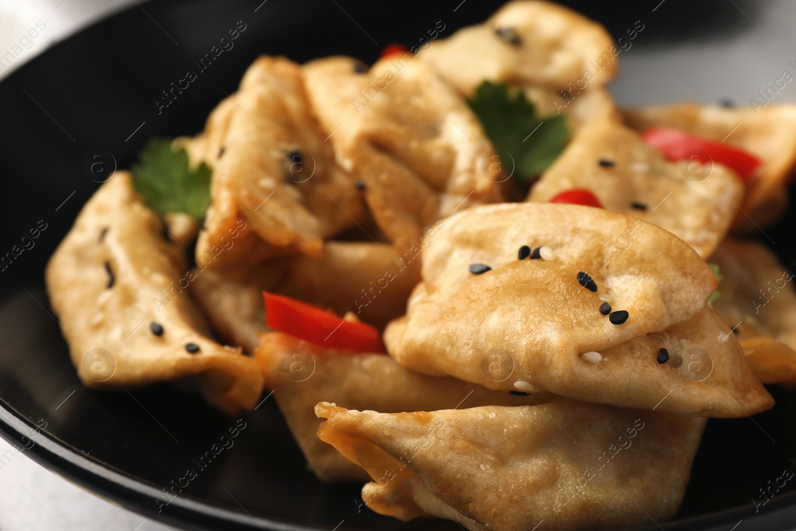 Photo of Delicious gyoza (asian dumplings) in bowl, closeup