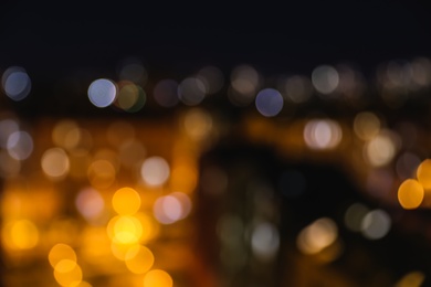 Photo of Blurred view of modern city at night. Bokeh effect