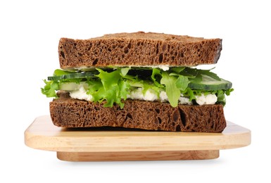 Tasty sandwich with cream cheese, cucumber and greens on white background