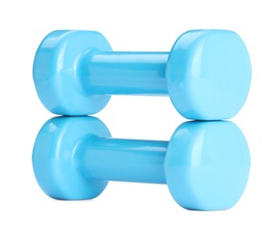 Light blue dumbbells isolated on white. Sports equipment