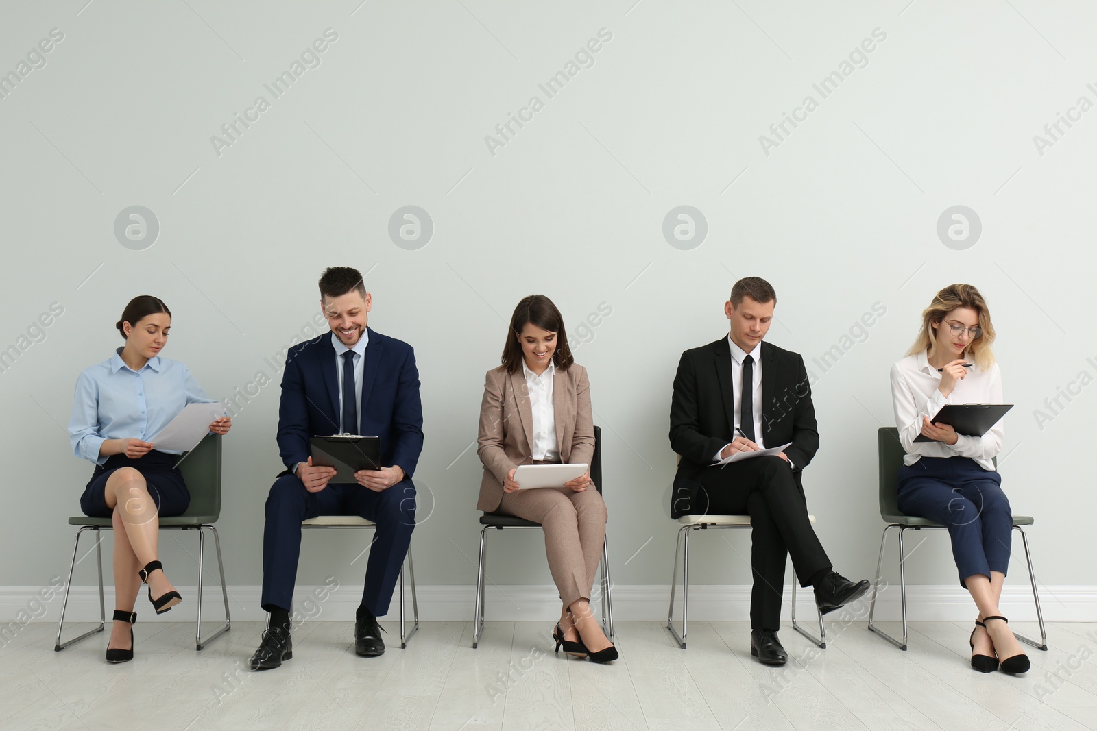 Photo of People waiting for job interview in office hall