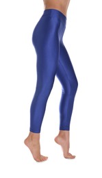 Woman with beautiful long legs wearing blue leggings on white background, closeup