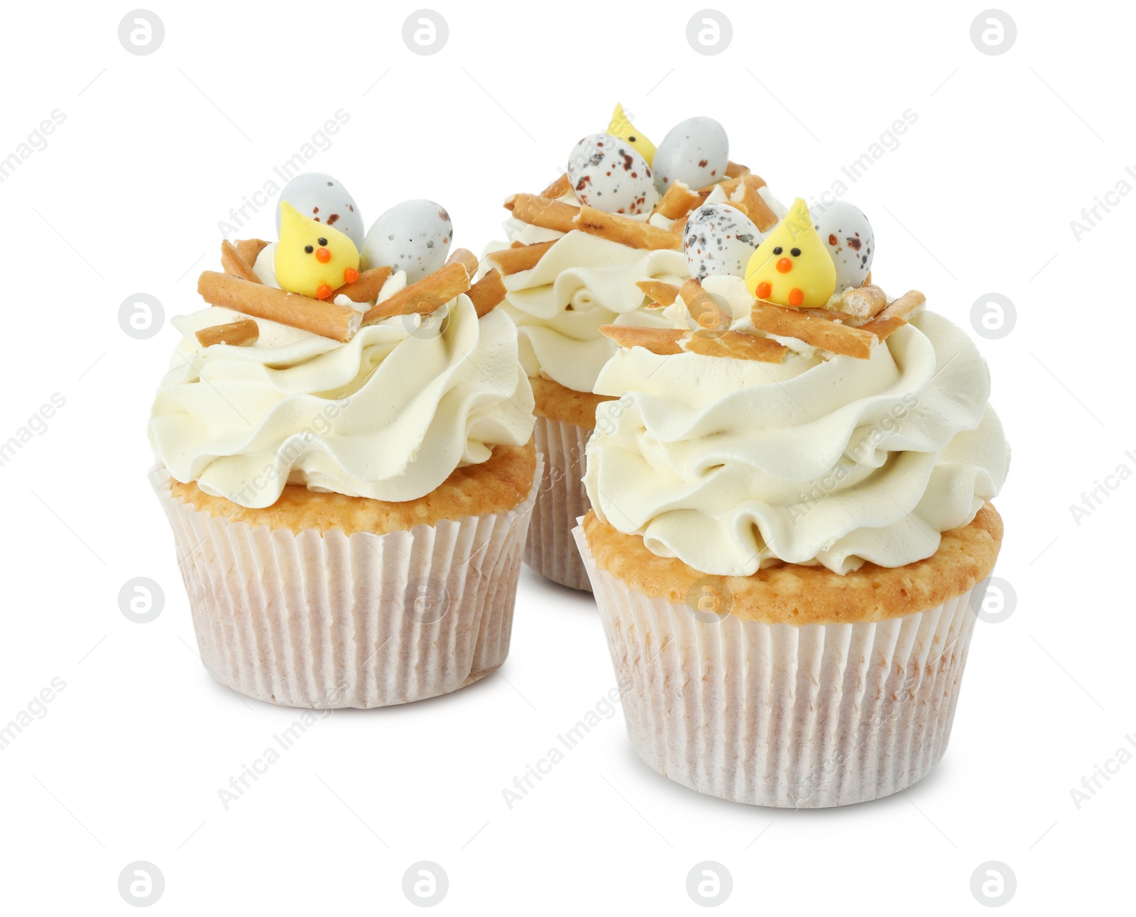 Photo of Tasty Easter cupcakes with vanilla cream isolated on white