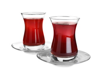 Photo of Glasses with traditional Turkish tea isolated on white