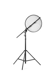 Photo of Tripod with studio reflector isolated on white. Professional photographer's equipment