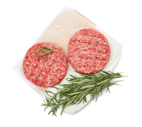 Photo of Raw hamburger patties with rosemary and salt on white background, top view