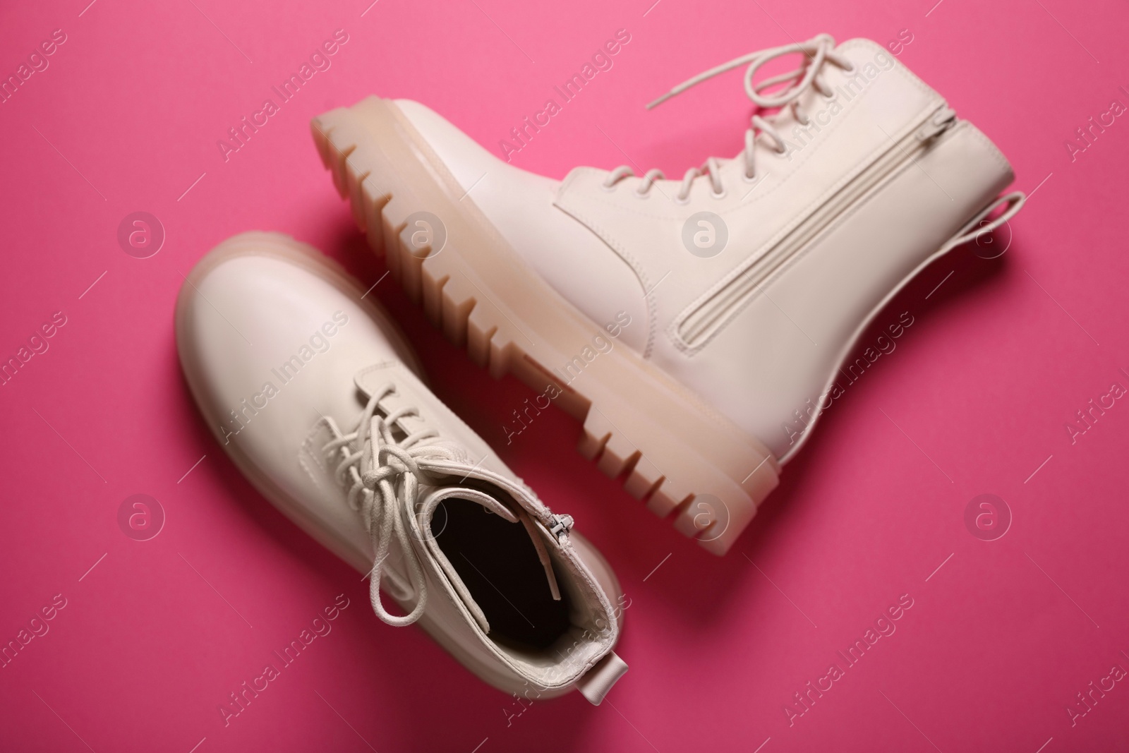 Photo of Pair of stylish leather shoes on pink background, flat lay