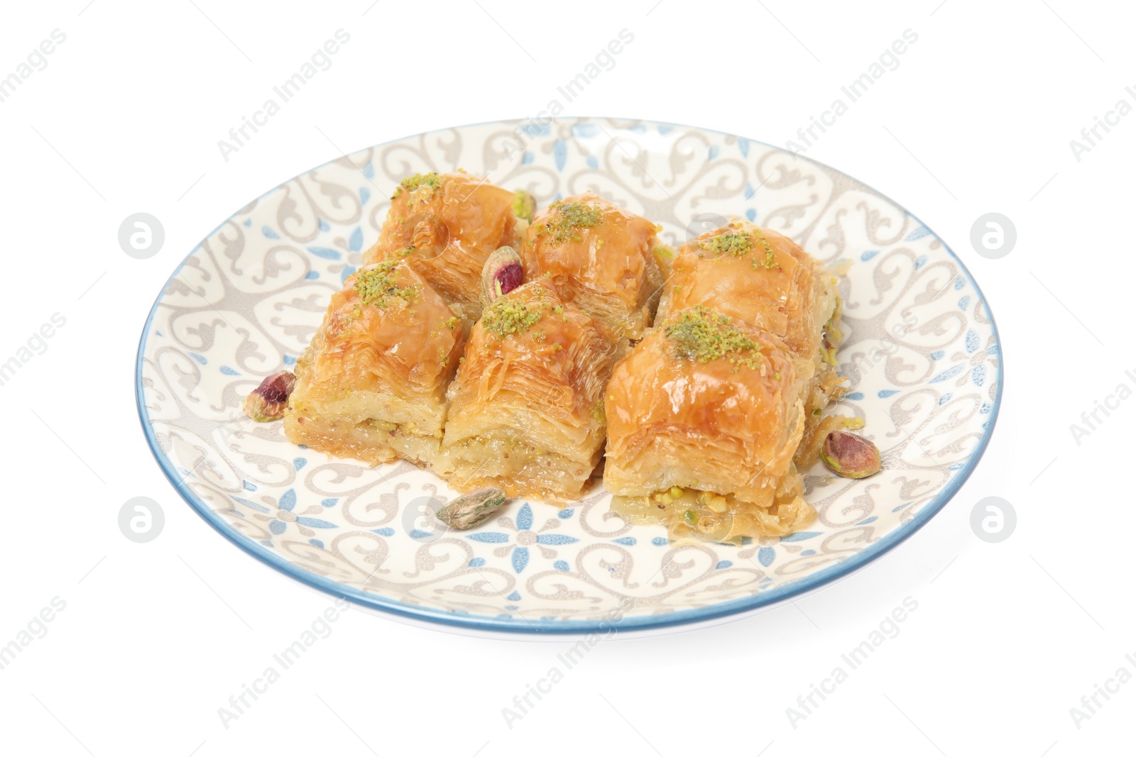 Photo of Plate of delicious baklava with pistachio nuts isolated on white