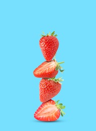 Image of Stack of fresh strawberries on light blue background