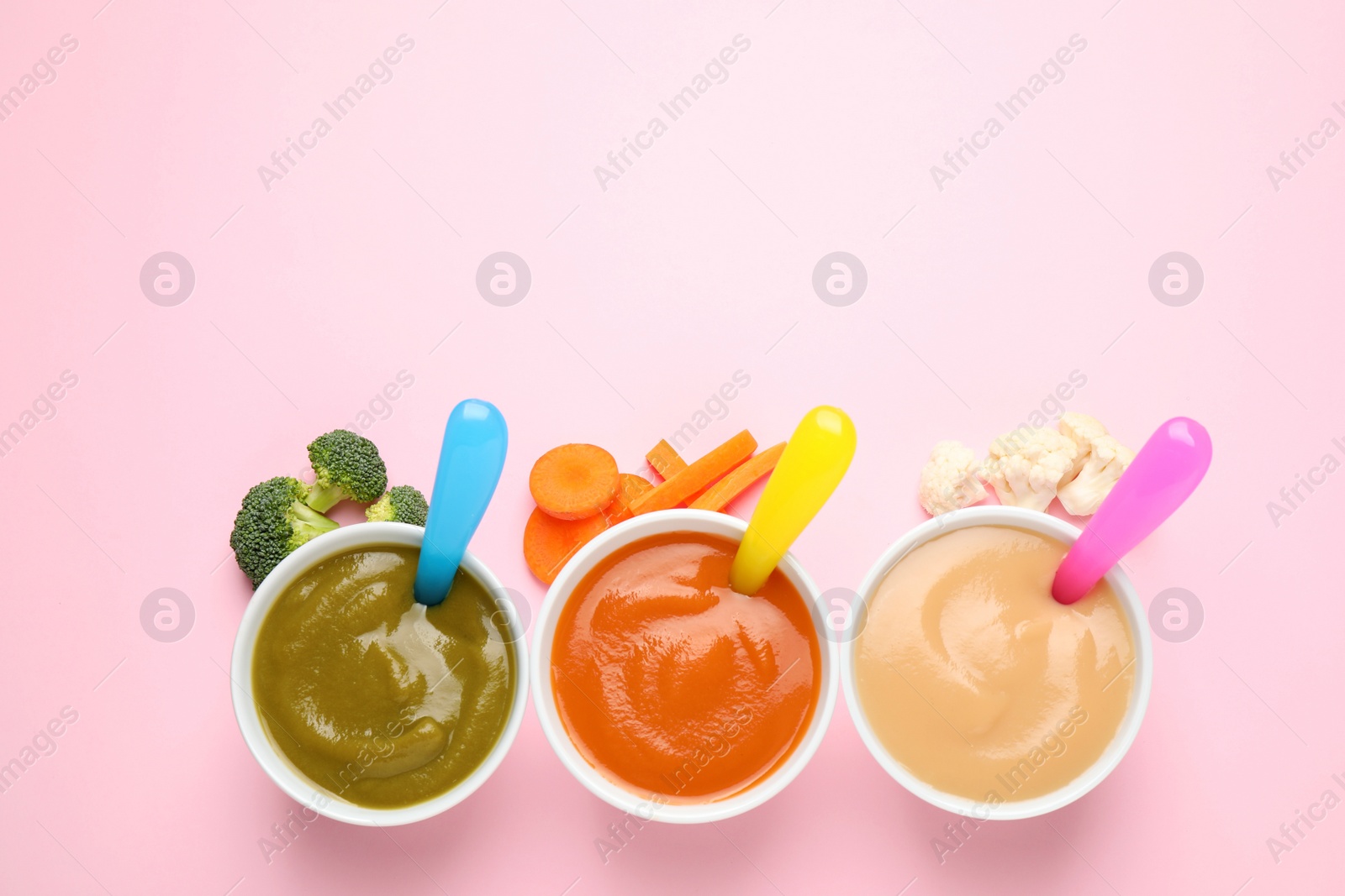 Photo of Healthy baby food and ingredients on pink background, flat lay. Space for text