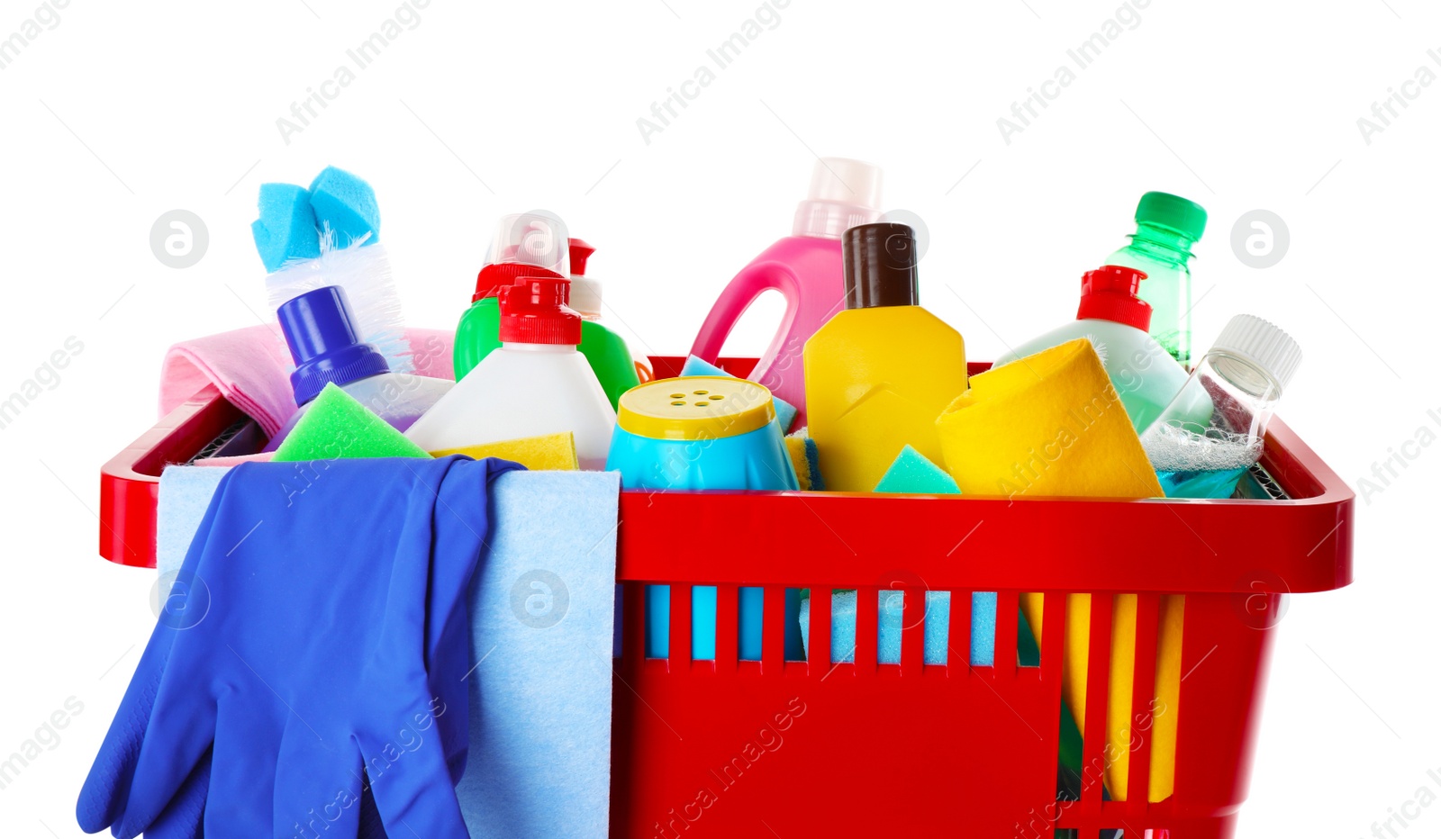 Photo of Shopping basket with different detergents, rag and gloves on white background