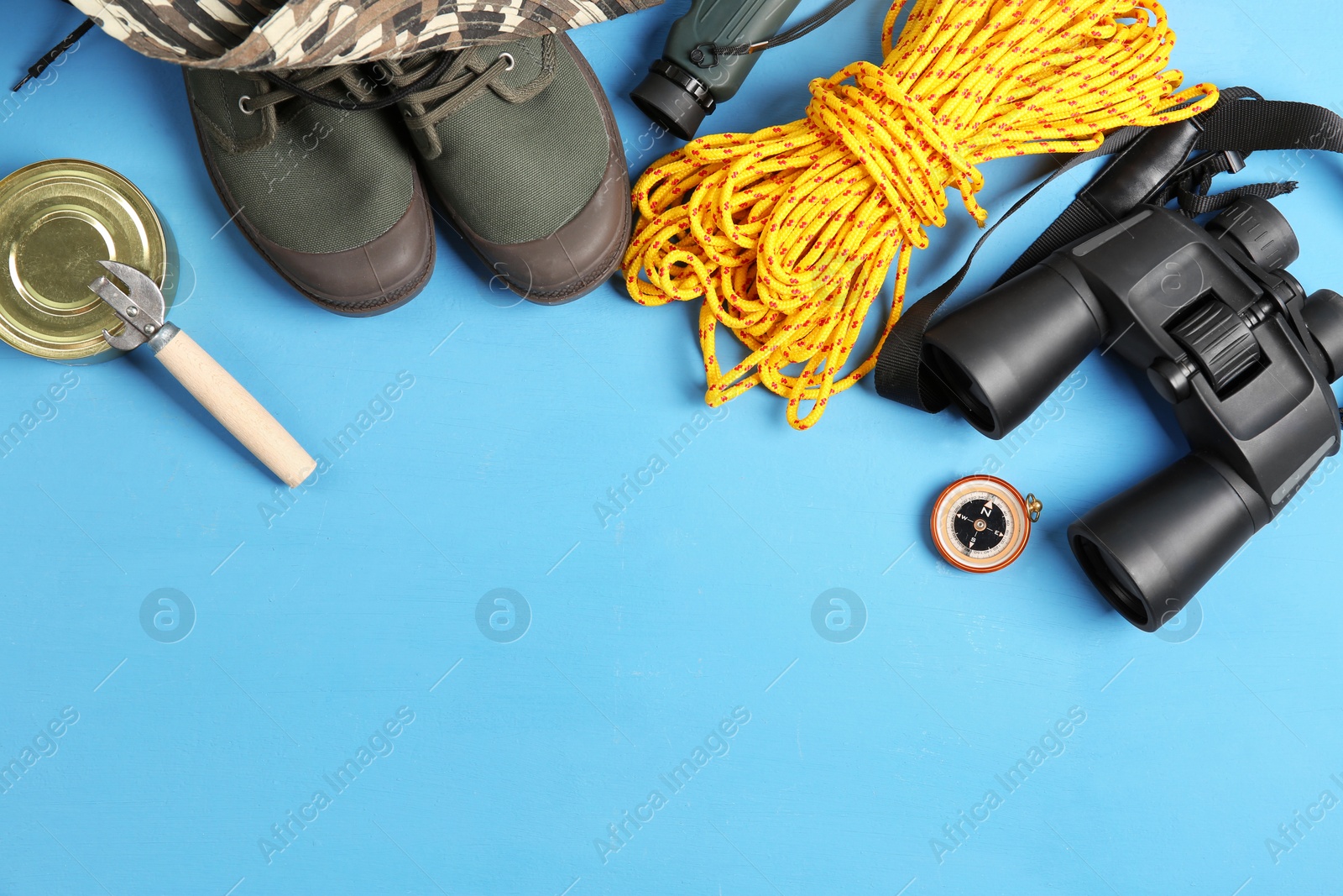 Photo of Flat lay composition with camping equipment on color background