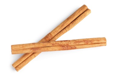 Photo of Cinnamon sticks isolated on white, top view