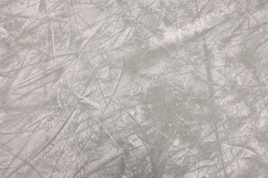 Photo of Frozen ice skating surface as background, top view. Winter season