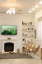 Photo of Cozy living room interior with decorative fireplace