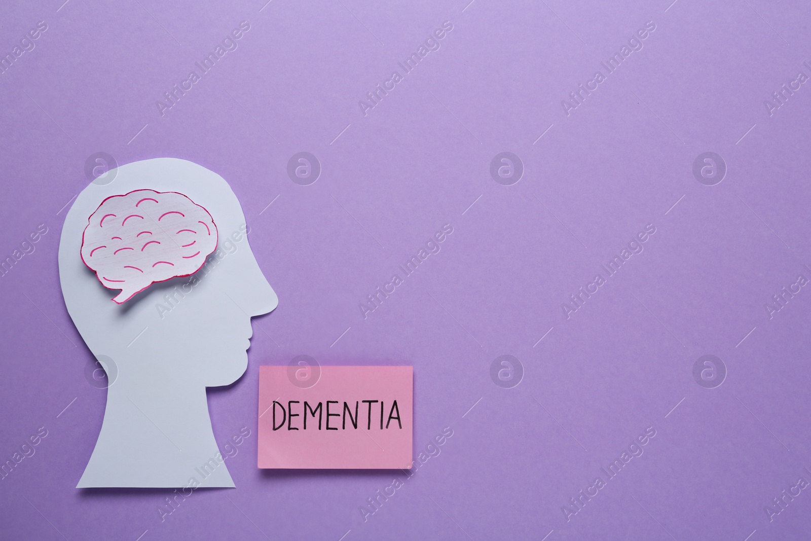 Photo of Note with word Dementia near human head and brain paper cutout on violet background, flat lay. Space for text