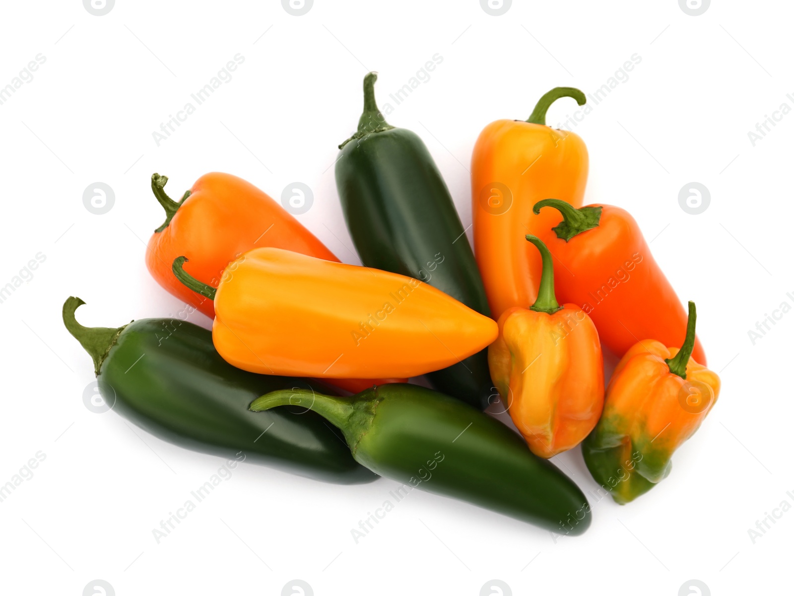 Photo of Different hot chili peppers isolated on white, top view