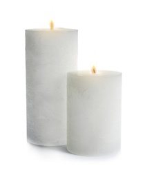 Photo of Two decorative wax candles on white background