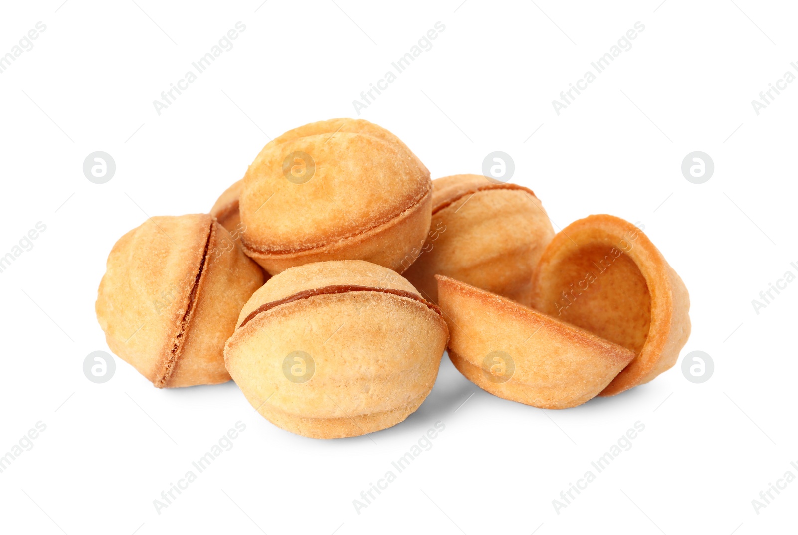 Photo of Delicious nut shaped cookies with condensed milk on white background