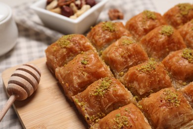 Delicious sweet baklava with pistachios on table, closeup